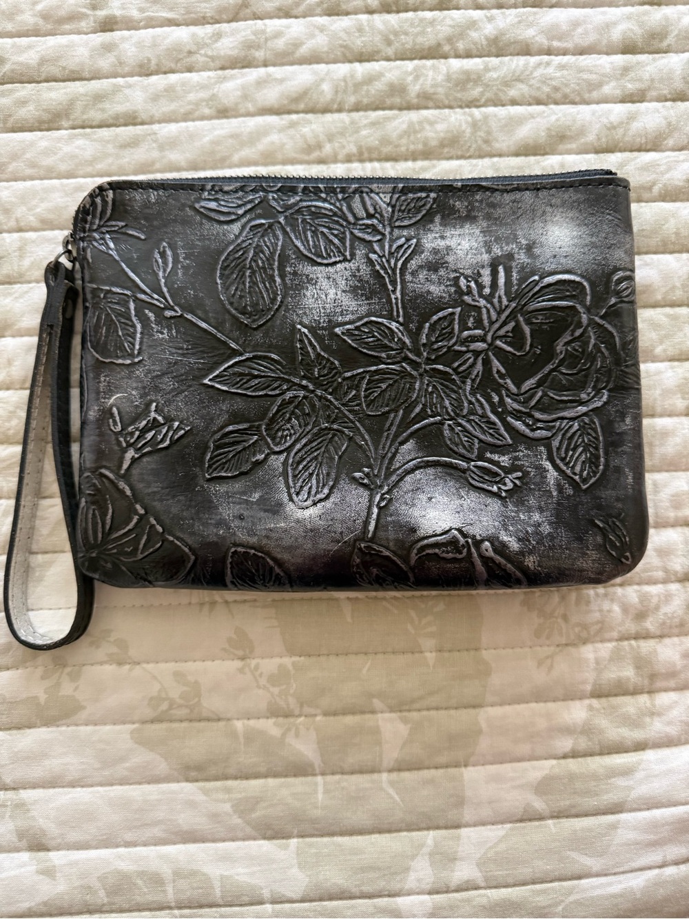 Embossed Floral Leather Wristlet Clutch in Metallic Black